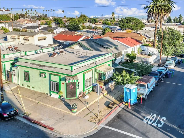 an aerial view of residential houses with outdoor space