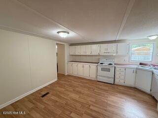 1581 Snapper Street Southwest Shallotte, NC 28470 - Photo 13 of 22 kitchen with view of dining area.
