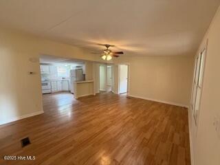 1581 Snapper Street Southwest Shallotte, NC 28470 - Photo 10 of 22 2nd view living area to kitchen.