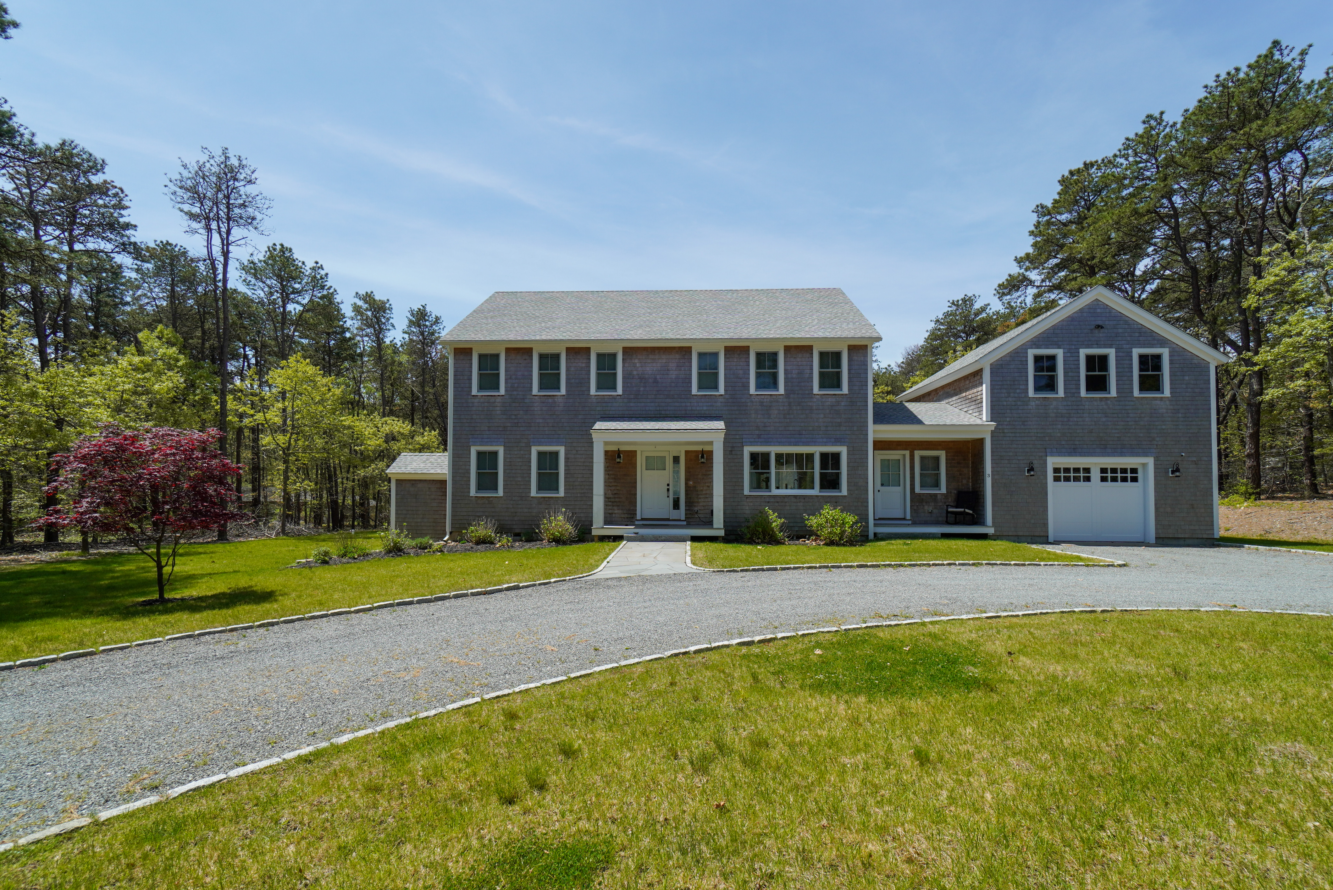 3 Sengekontacket Road Oak Bluffs, MA 02557 - Photo 2 of 34 a front view of a house with a yard and trees