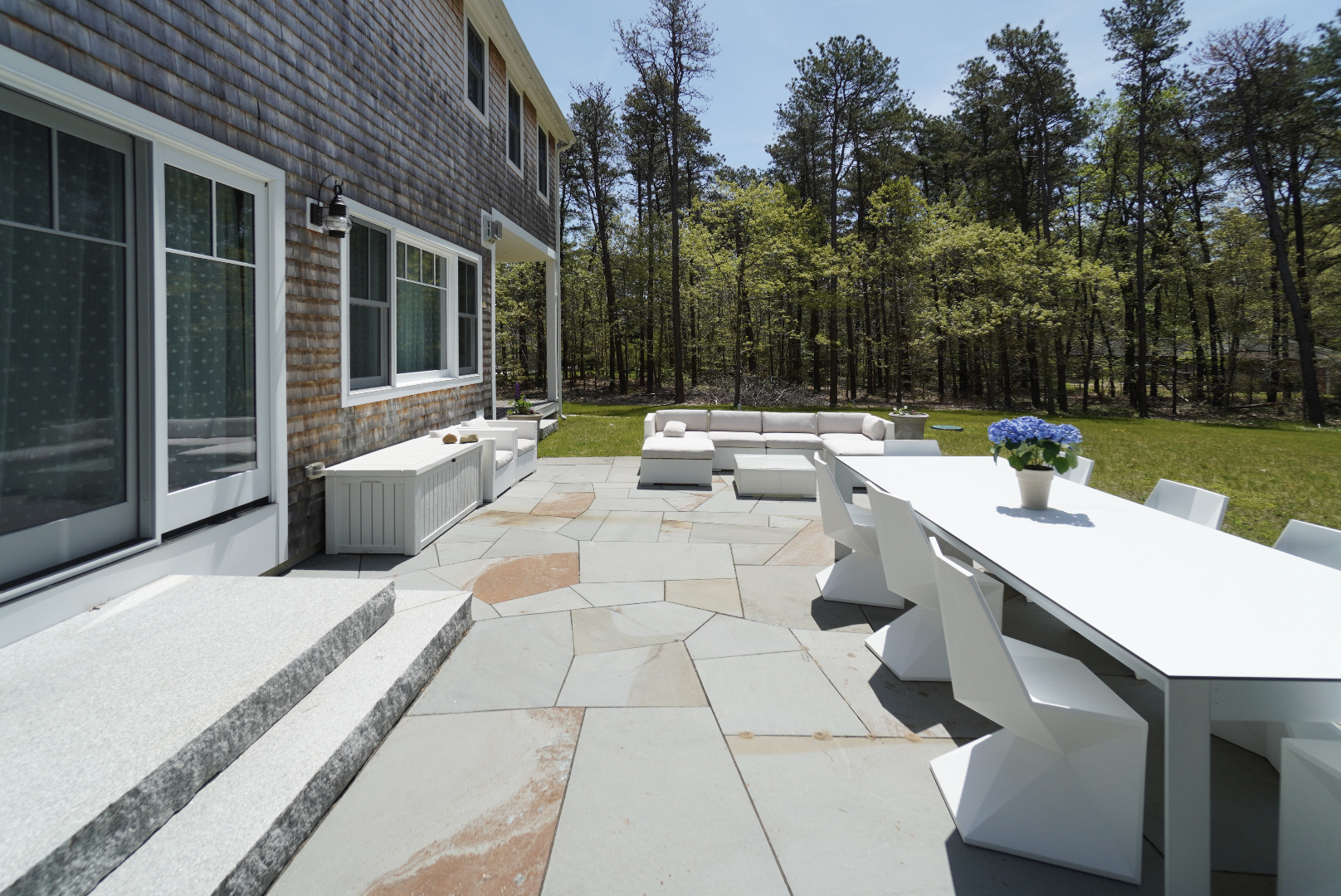 3 Sengekontacket Road Oak Bluffs, MA 02557 - Photo 29 of 34 a view of a patio with couches and table and chairs with garden view