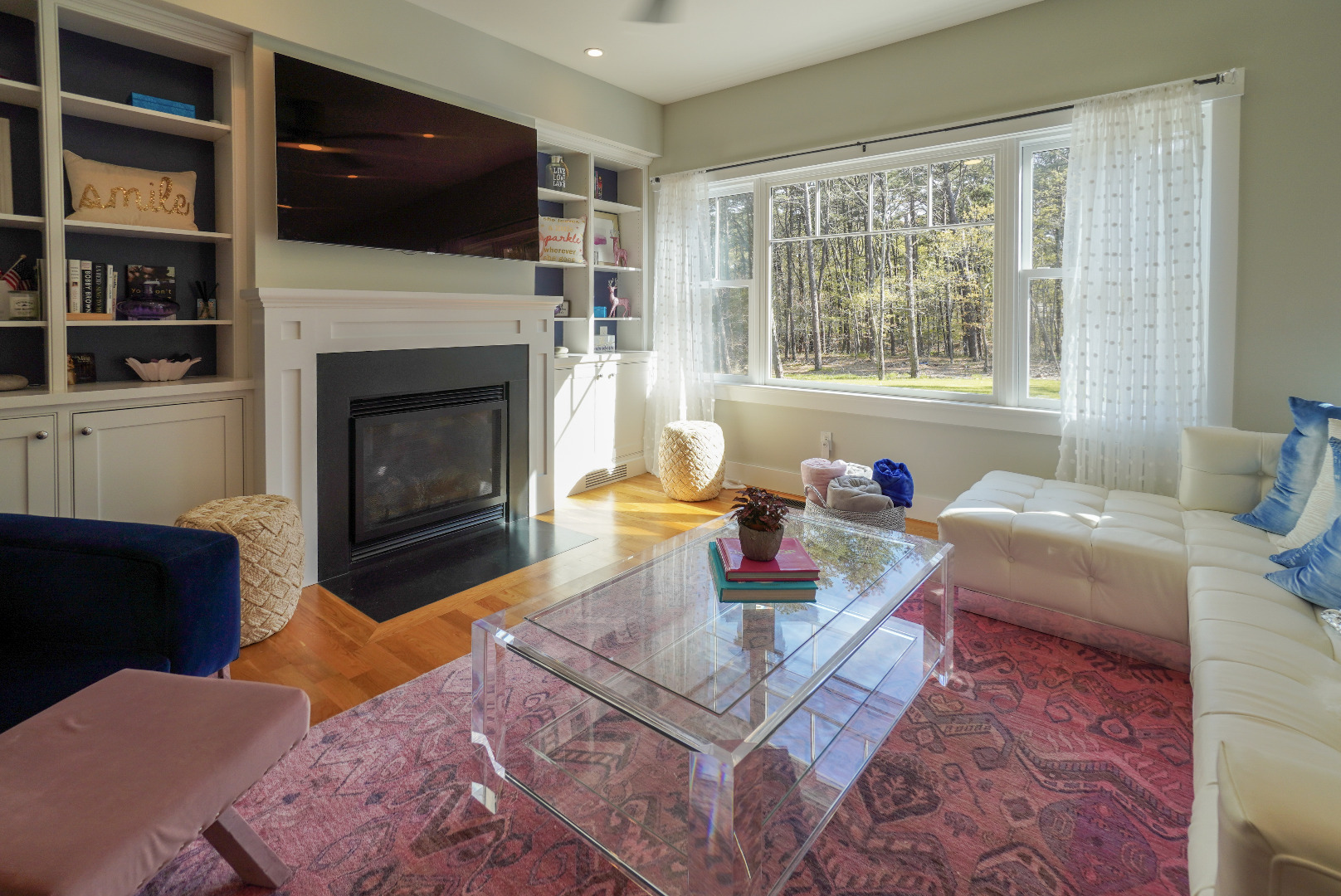 3 Sengekontacket Road Oak Bluffs, MA 02557 - Photo 5 of 34 a living room with furniture a flat screen tv and a fireplace