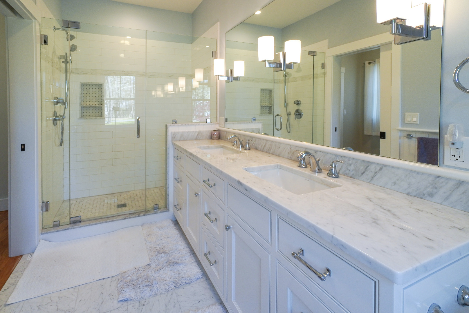 3 Sengekontacket Road Oak Bluffs, MA 02557 - Photo 10 of 34 a bathroom with a double vanity sink shower and a mirror