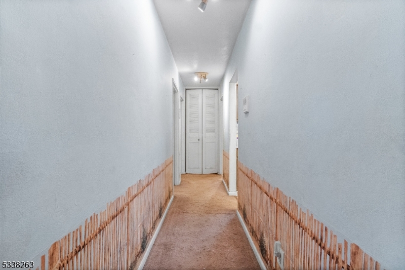 468 Liberty Street, Unit 101 Little Ferry, NJ 07643 - Photo 15 of 18 a view of a hallway with wooden floor