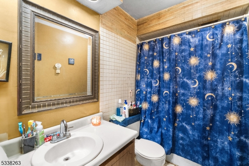 468 Liberty Street, Unit 101 Little Ferry, NJ 07643 - Photo 17 of 18 a bathroom with a sink and a mirror