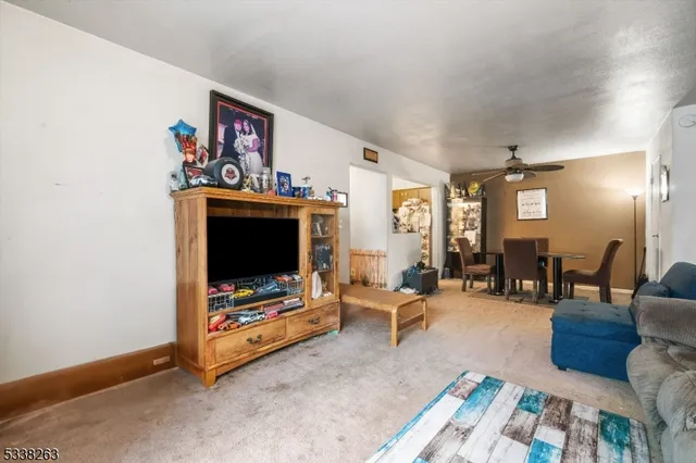 a bedroom with furniture and a large window