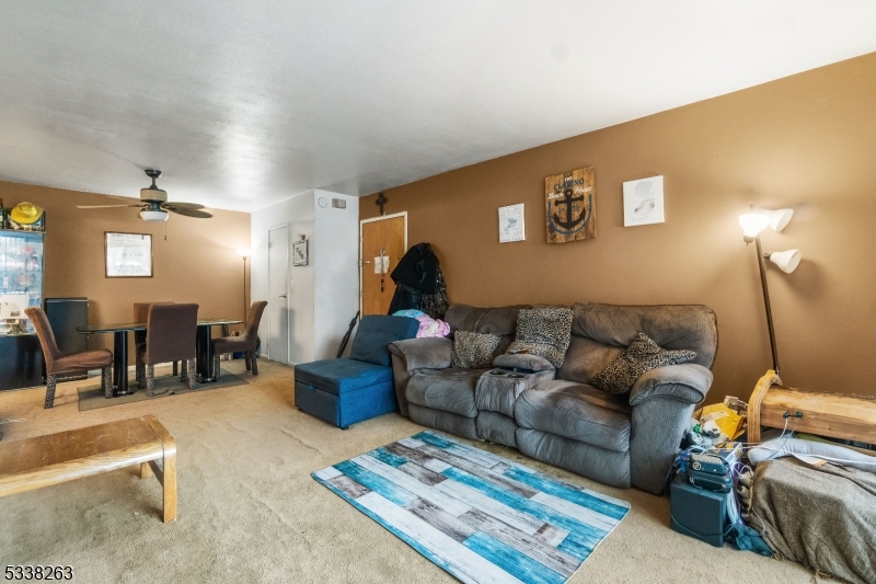 468 Liberty Street, Unit 101 Little Ferry, NJ 07643 - Photo 7 of 18 a living room with furniture and wooden floor