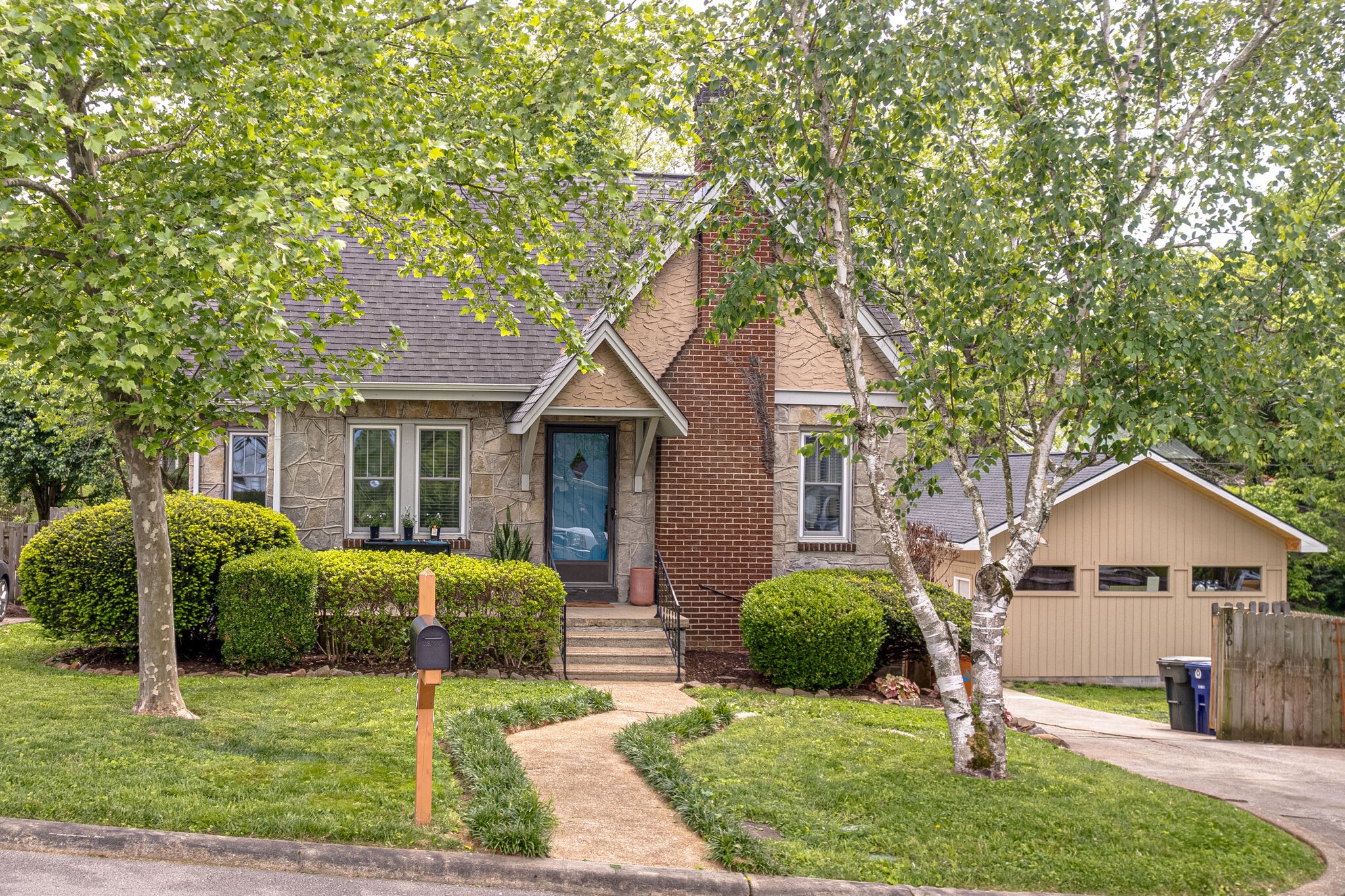 606 3rd Avenue West Springfield, TN 37172 - Photo 3 of 47 a front view of a house with a yard and garage