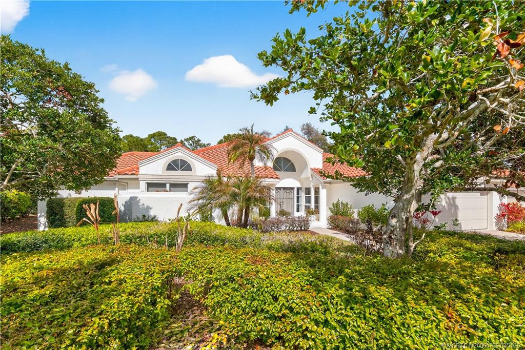 13319 Northwest Maplewood Road Palm City, FL 34990 - Photo 29 of 42 a front view of a house with a yard