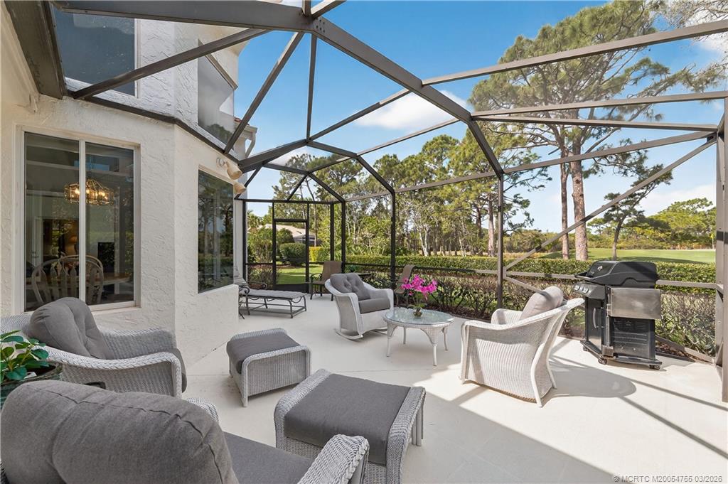 13319 Northwest Maplewood Road Palm City, FL 34990 - Photo 31 of 42 Screen Enclosed Patio with Golf Course Views