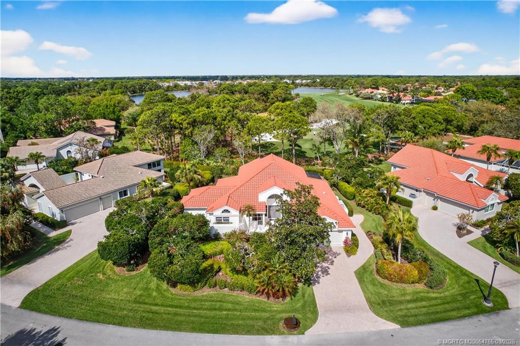 13319 Northwest Maplewood Road Palm City, FL 34990 - Photo 32 of 42 an aerial view of a house with a yard basket ball court and outdoor seating