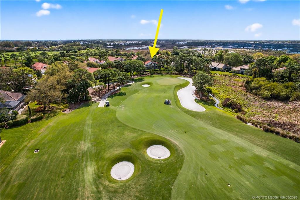 13319 Northwest Maplewood Road Palm City, FL 34990 - Photo 41 of 42 a view of a swimming pool with an outdoor space and seating area