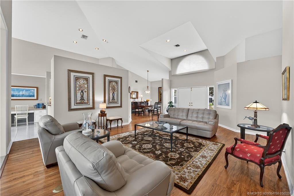 13319 Northwest Maplewood Road Palm City, FL 34990 - Photo 5 of 42 a living room with furniture or couch and a wooden floor