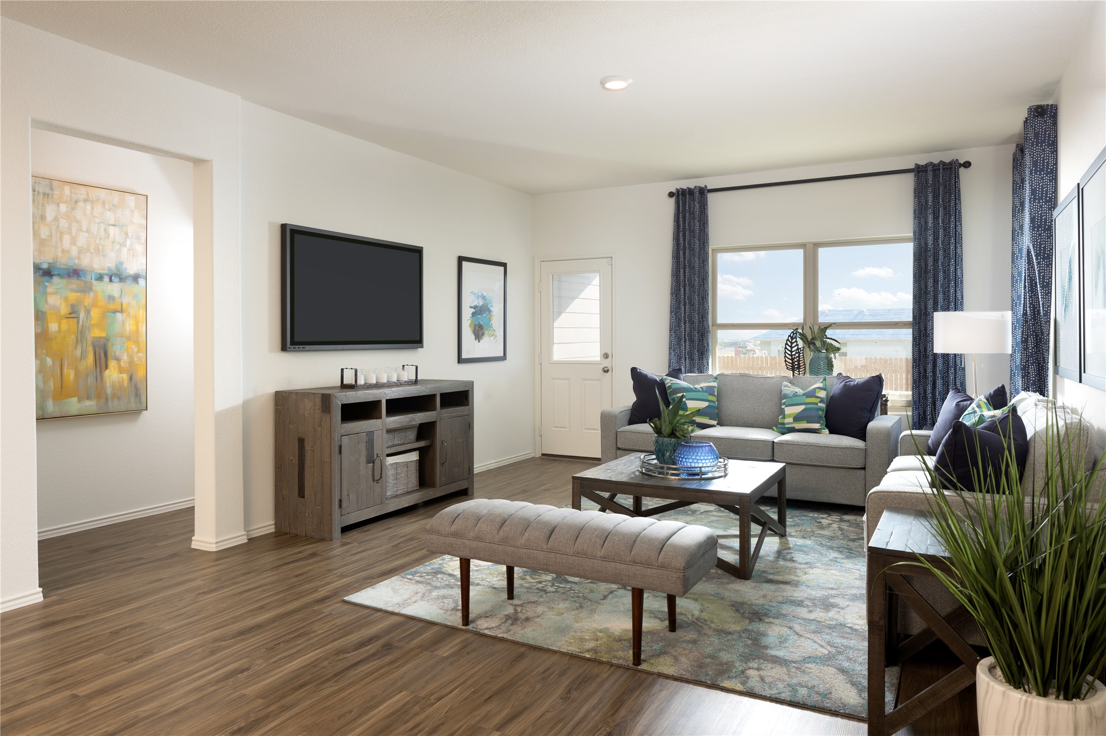 107 Sapling Dew Drive Georgetown, TX 78628 - Photo 16 of 16 a living room with furniture a flat screen tv and a large window
