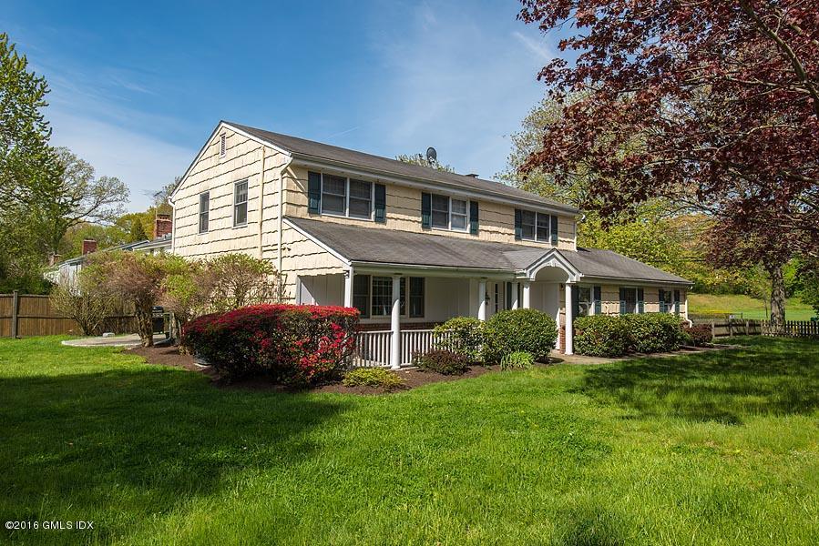 50 Old Orchard Road Riverside, CT 06878 - Photo 1 of 16 a front view of house with yard and green space