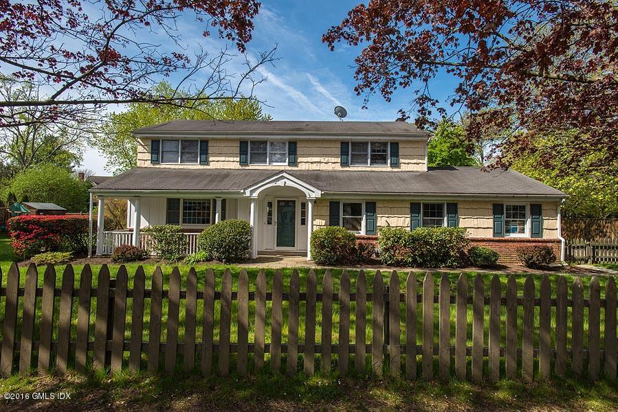 50 Old Orchard Road Riverside, CT 06878 - Photo 2 of 16 a front view of a house with a yard