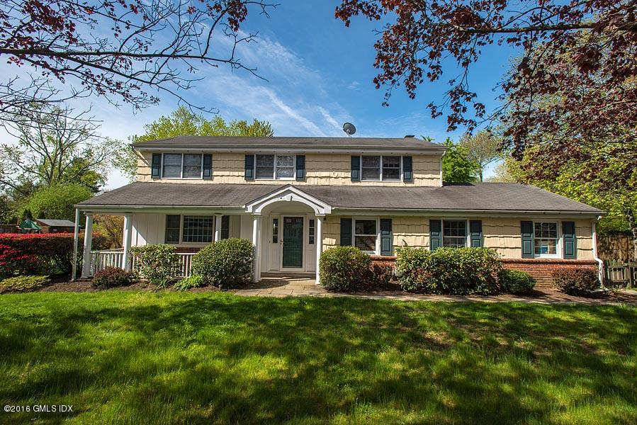 50 Old Orchard Road Riverside, CT 06878 - Photo 3 of 16 a front view of a house with garden