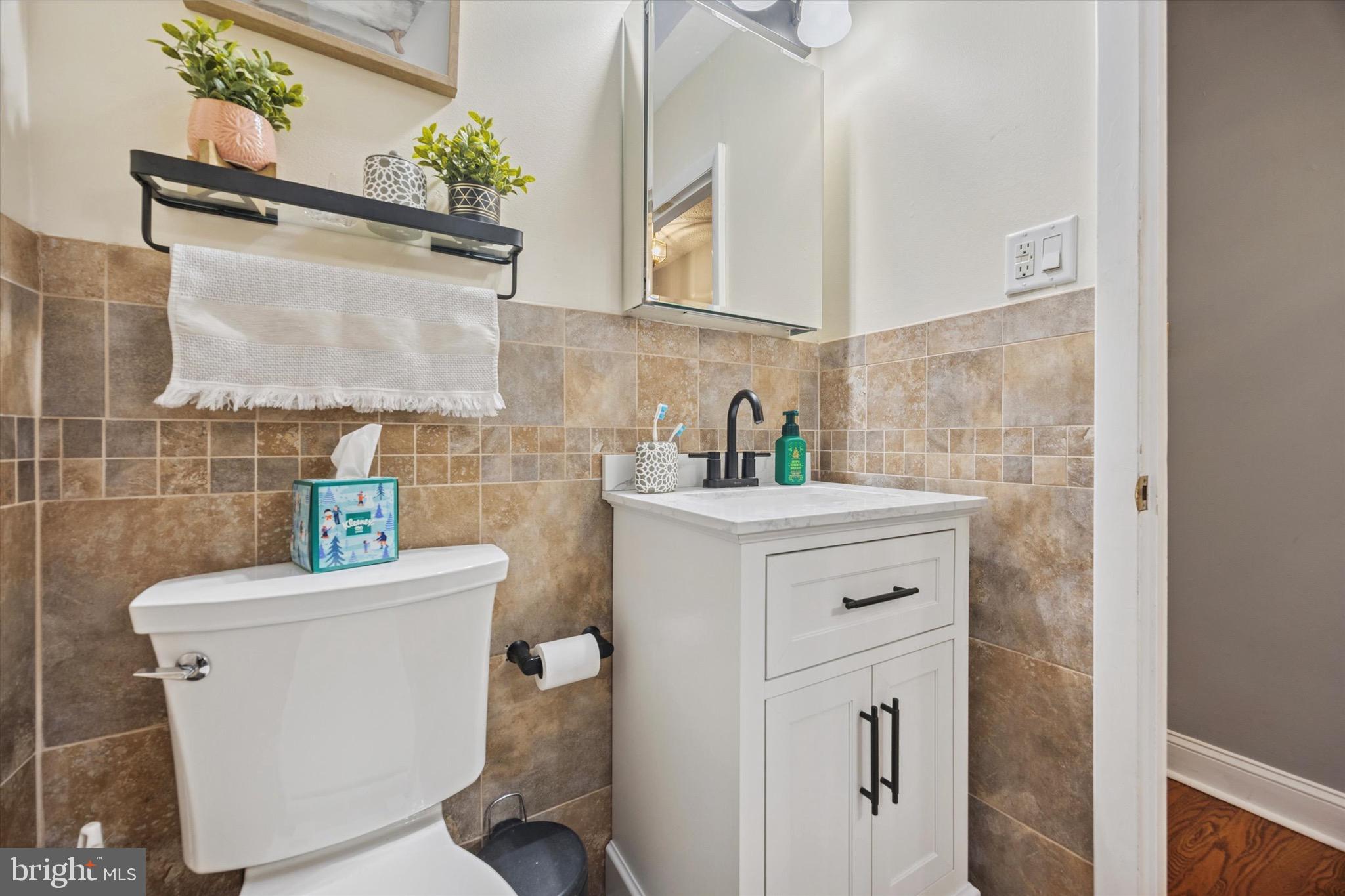 7025 Valley Avenue Philadelphia, PA 19128 - Photo 13 of 25 a bathroom with a sink a toilet and shower