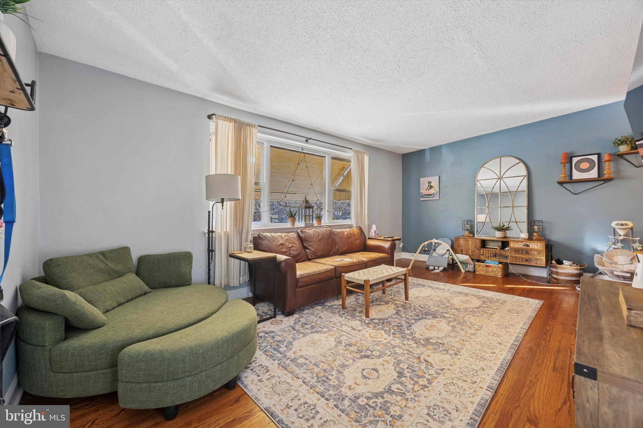 7025 Valley Avenue Philadelphia, PA 19128 - Photo 4 of 25 a living room with furniture and a large window