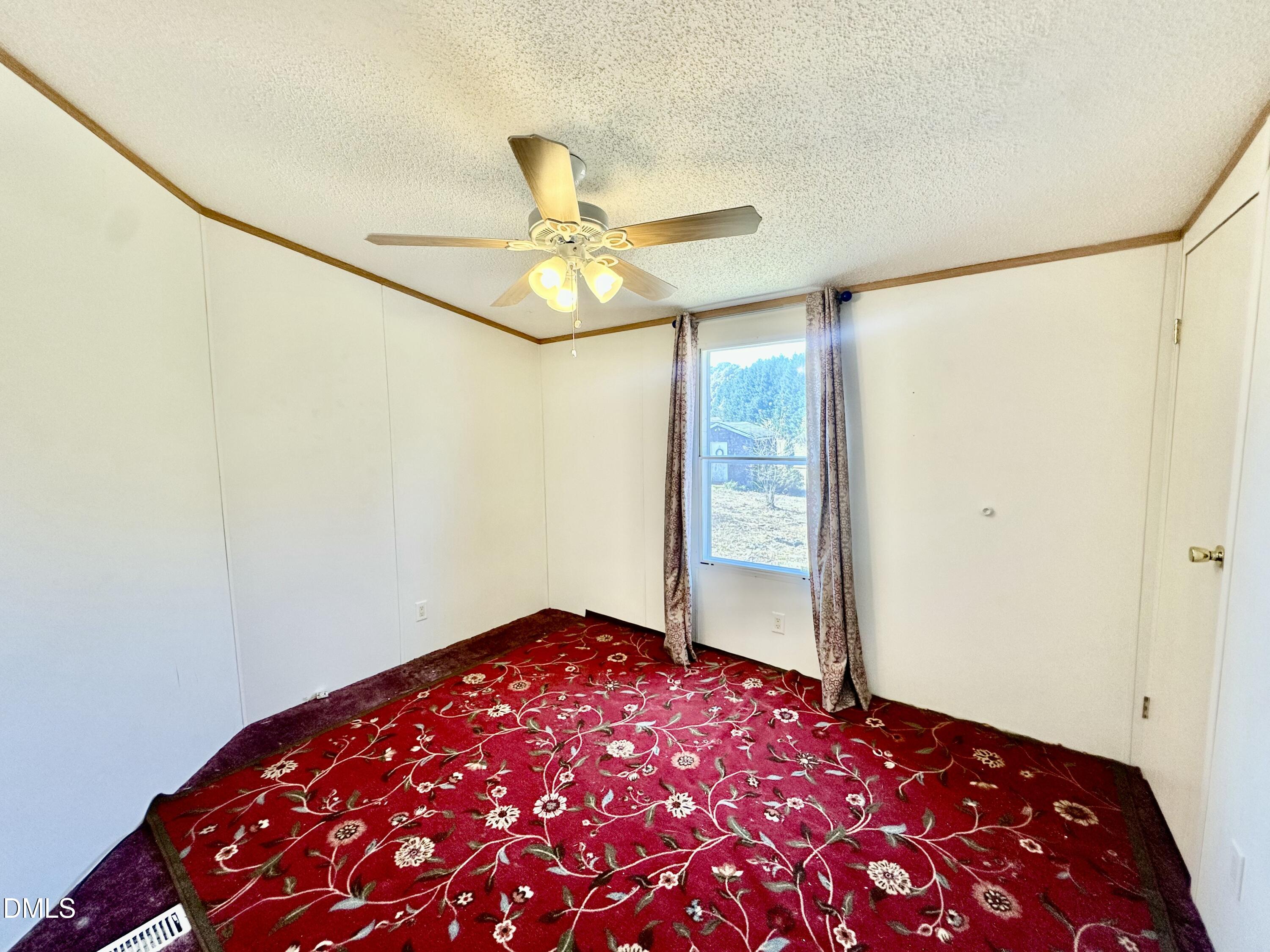 287 Oliver Loop Road Roxboro, NC 27574 - Photo 18 of 26 a bedroom with a bed and a window