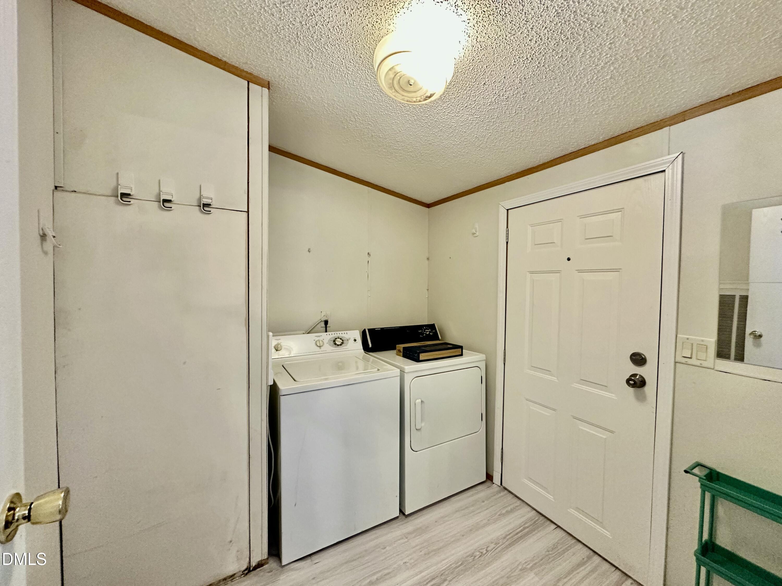287 Oliver Loop Road Roxboro, NC 27574 - Photo 22 of 26 a utility room with dryer and washer