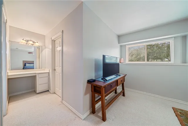 a view of workspace with flat screen tv and windows