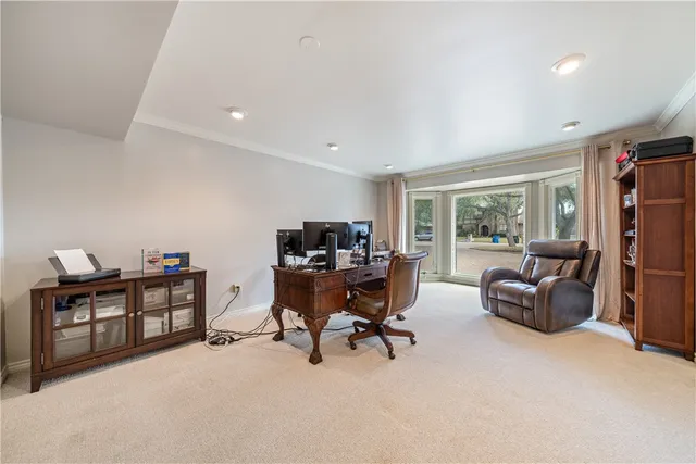 a view of a livingroom with workspace and a couch