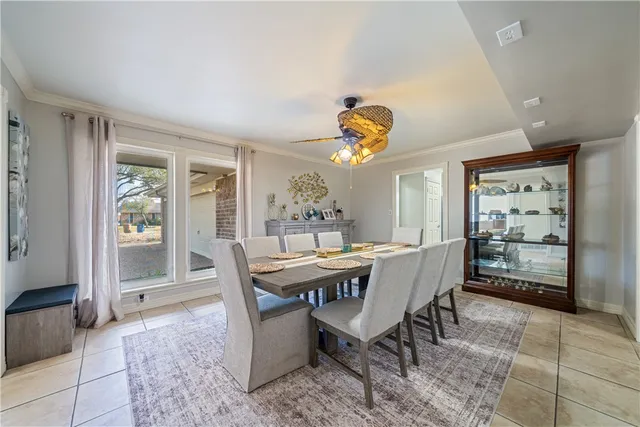 a dining room with furniture and window