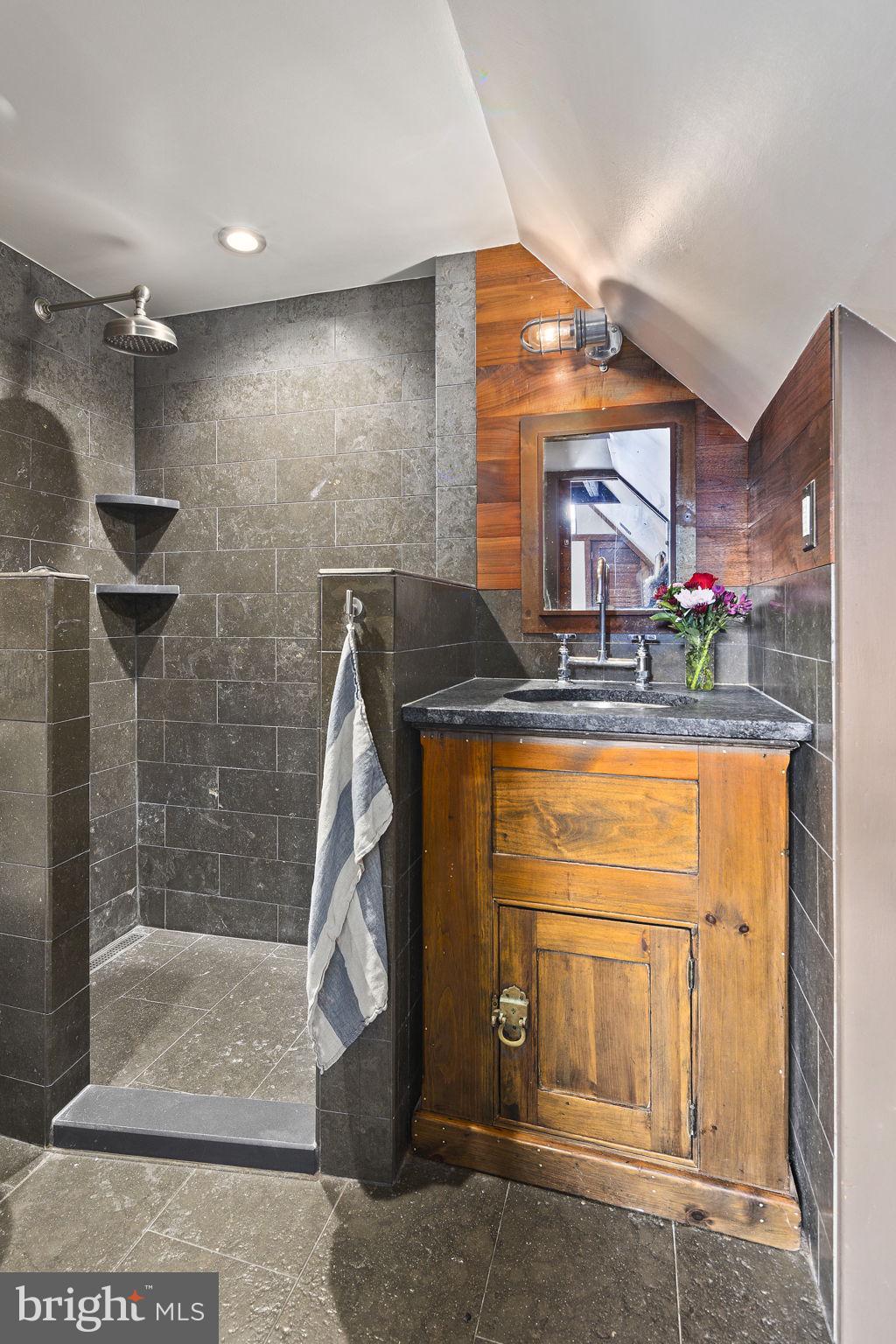 1624 U Street Northwest, Unit 400 Washington, DC 20009 - Photo 26 of 33 Floor & shower surround were lined with limestone