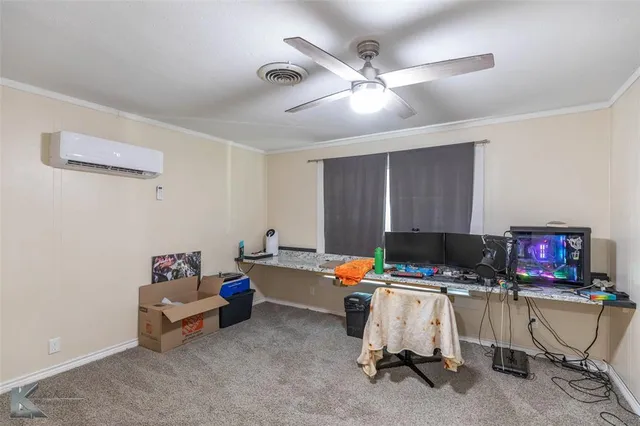 a workspace with furniture and a ceiling fan