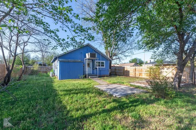 a house view with a garden space