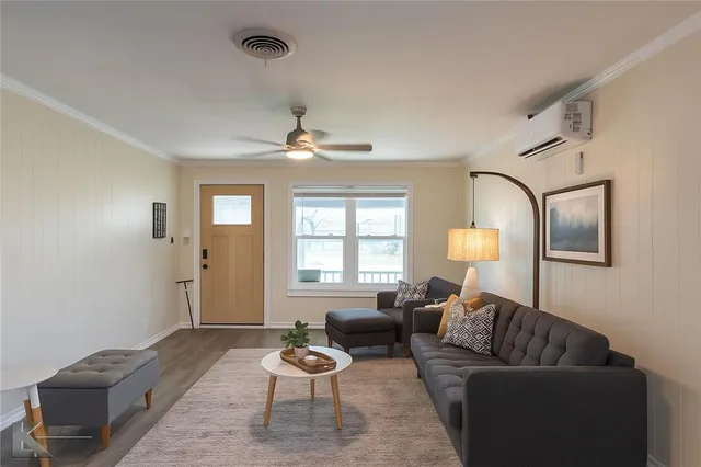 a living room with furniture and a window