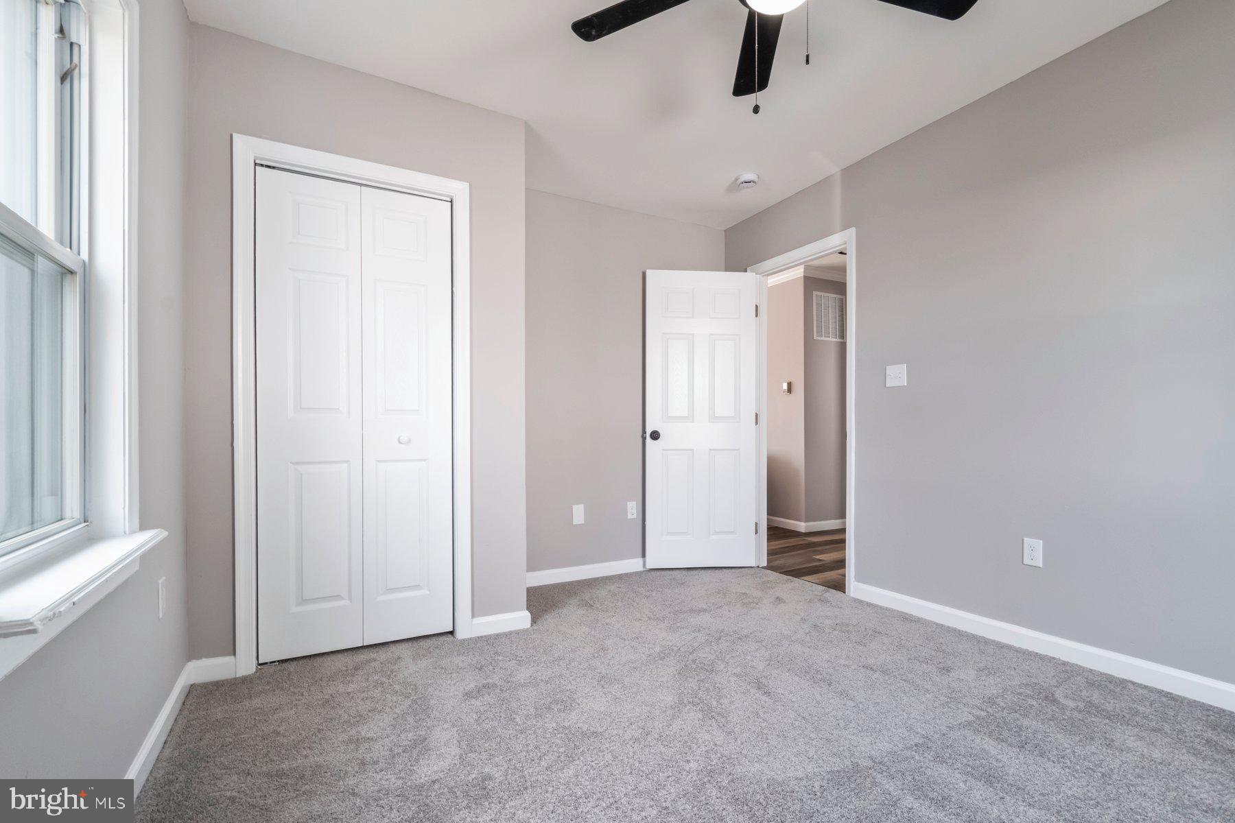 4 North Point Terrace Baltimore, MD 21222 - Photo 15 of 32 an empty room with hallway closet and chandelier fan