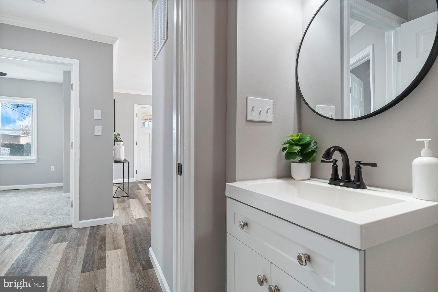 4 North Point Terrace Baltimore, MD 21222 - Photo 18 of 32 a bathroom with a sink and a mirror