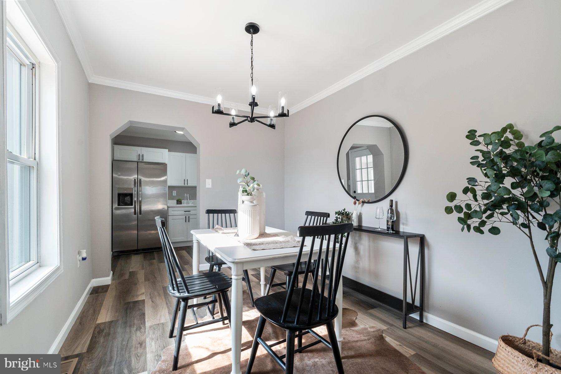4 North Point Terrace Baltimore, MD 21222 - Photo 5 of 32 a view of a dining room with furniture and a chandelier