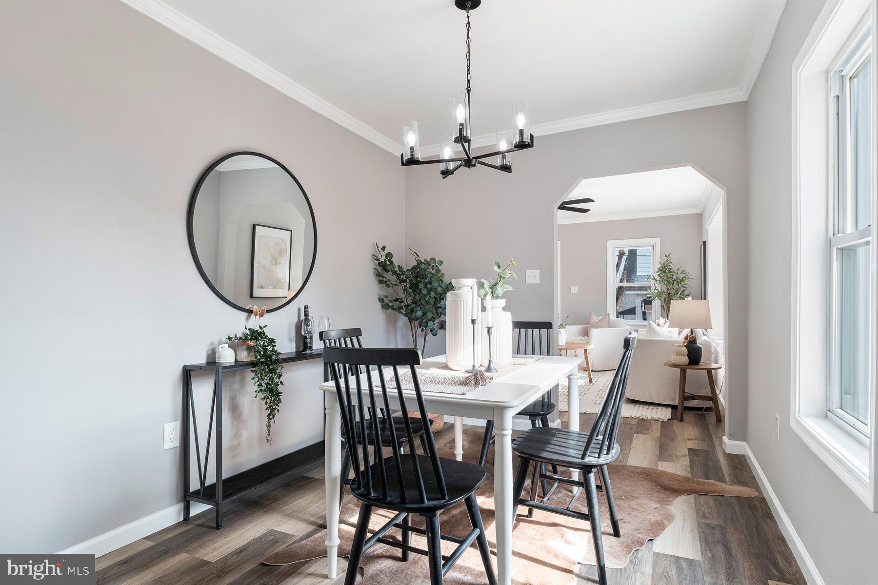 4 North Point Terrace Baltimore, MD 21222 - Photo 6 of 32 a view of a dining room with furniture a chandelier and wooden floor