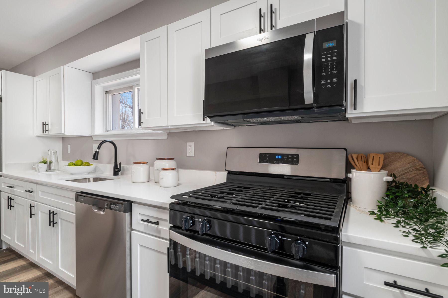 4 North Point Terrace Baltimore, MD 21222 - Photo 10 of 32 a kitchen with stainless steel appliances a sink a stove and microwave