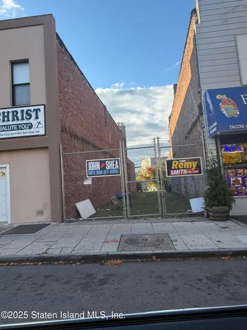 a view of a street with stores
