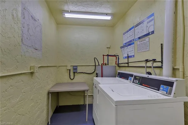 a view of storage and utility room with racks on the wall