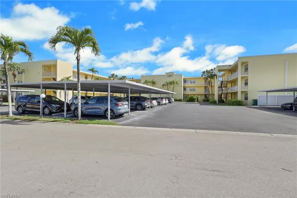 a view of street with parked cars
