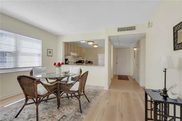a dining room with furniture and window