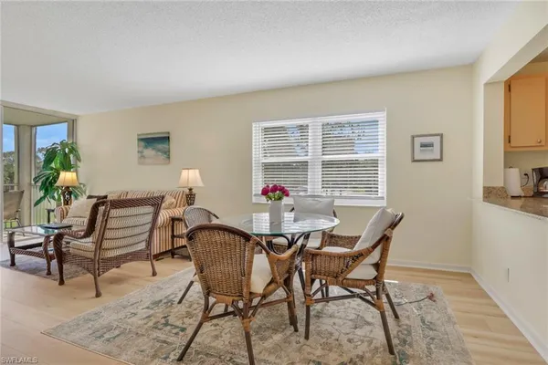 a dining room with furniture and window