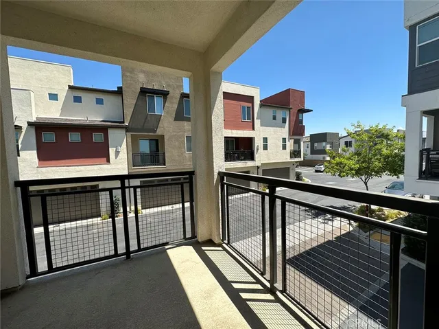 a view of a balcony with an outdoor seating