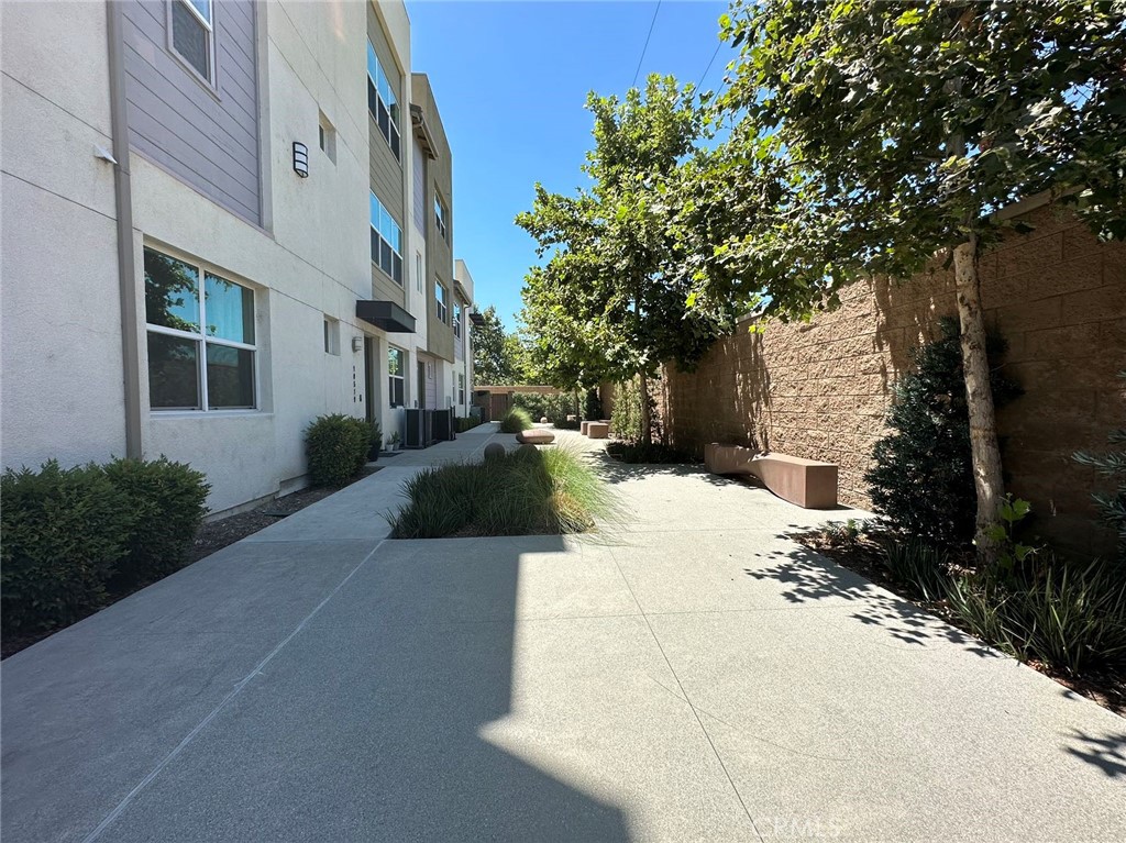 10517 Huxley Drive Rancho Cucamonga, CA 91730 - Photo 16 of 16 a view of a building with a yard