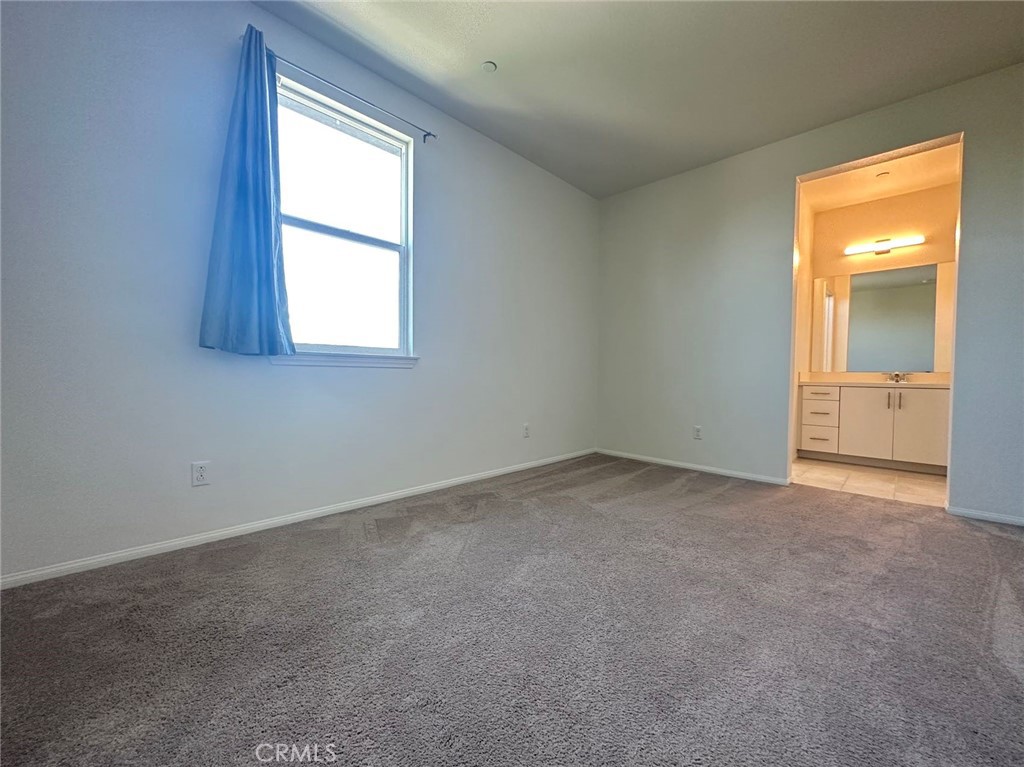 10517 Huxley Drive Rancho Cucamonga, CA 91730 - Photo 9 of 16 an empty room with a window