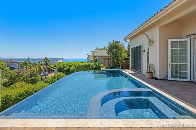 a view of swimming pool with a outdoor seating