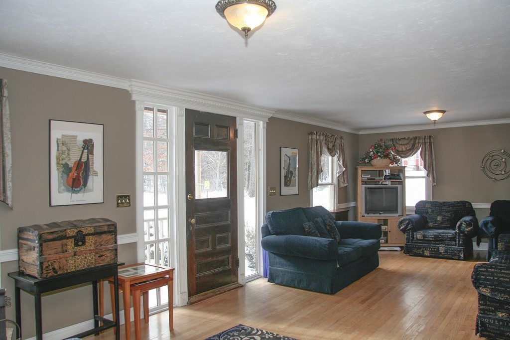 52 Marlboro Road Berlin, MA 01503 - Photo 14 of 30 a living room with furniture a ceiling fan and a window