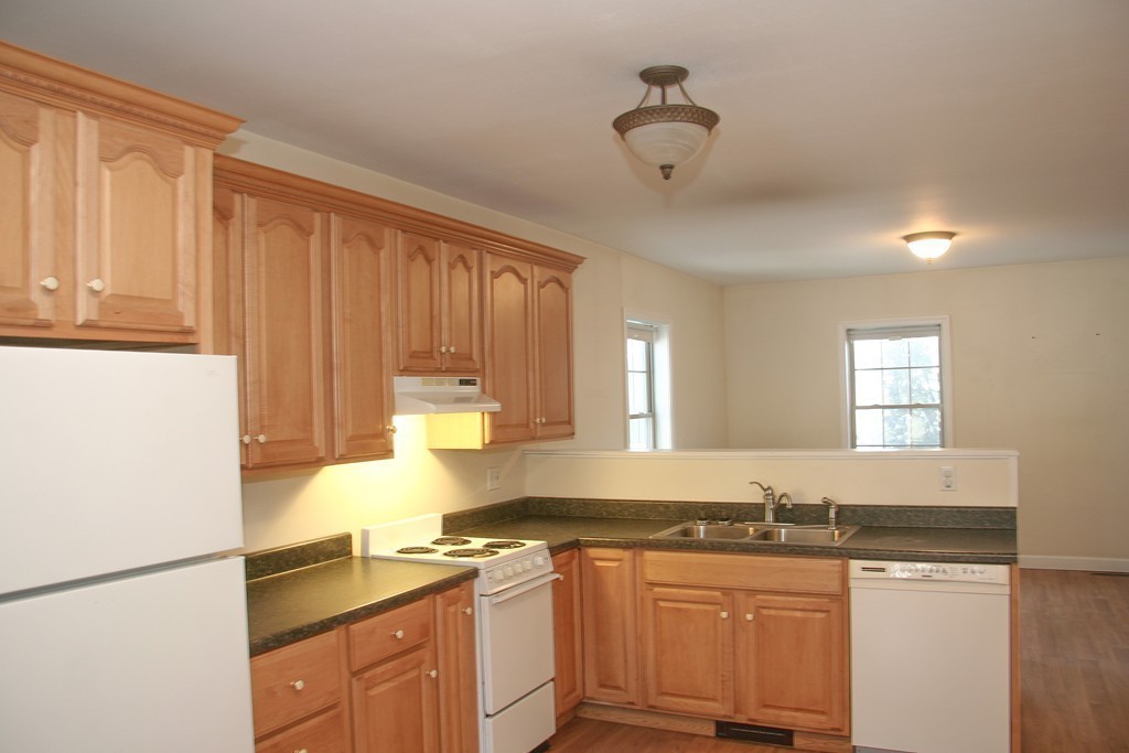 52 Marlboro Road Berlin, MA 01503 - Photo 23 of 30 a kitchen with stainless steel appliances granite countertop a sink stove and cabinets