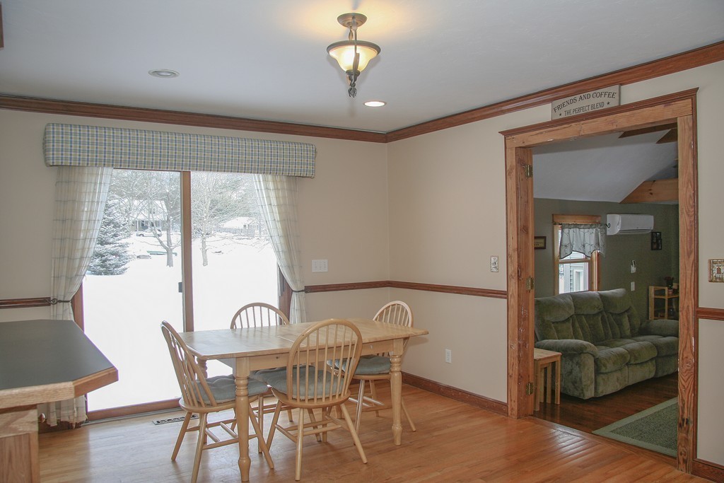 52 Marlboro Road Berlin, MA 01503 - Photo 6 of 30 a view of a dining room with furniture window and wooden floor