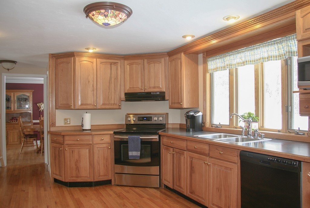 52 Marlboro Road Berlin, MA 01503 - Photo 10 of 30 a kitchen with stainless steel appliances granite countertop a sink a stove and a refrigerator